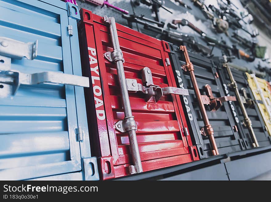 Stacks of metal military ammunition boxes.