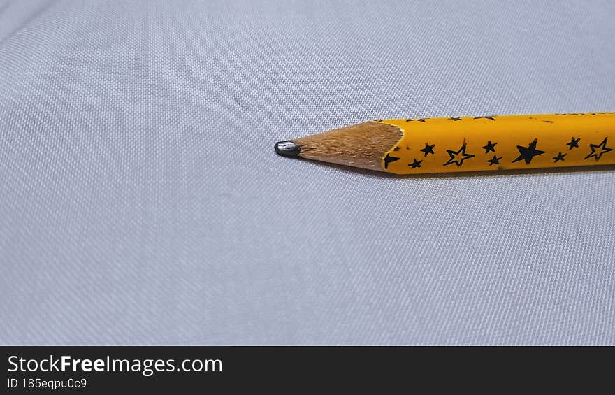 mustard color led pencil with white background