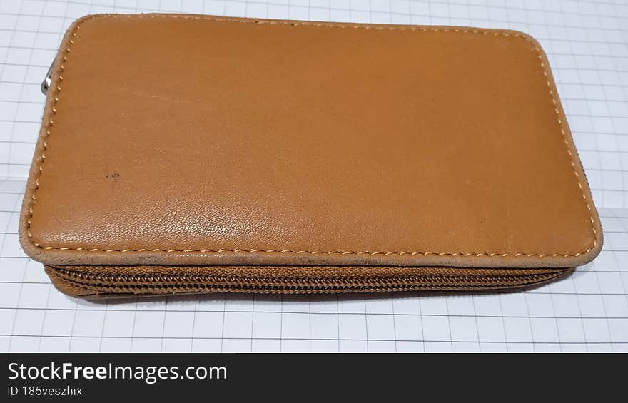 Brown wallet on white background