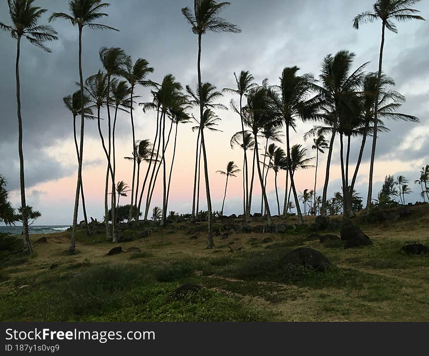 Sunset during Full Moon in June at Hikinaakala Heiau in Wailua on Kauai Island, Hawaii.