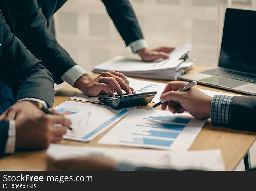 Business team meeting to meet professional investors working on new marketing business strategies. Project discussion and data analysis, charts and graphs, finance and accounting with the laptop...