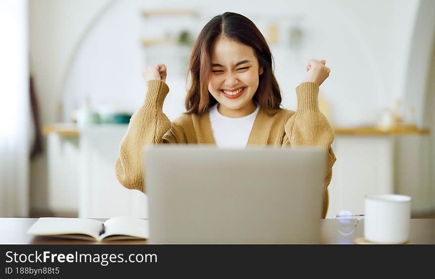 Excited asian female feeling euphoric celebrating online win success achievement result, young woman happy about good email news, motivated by great offer or new opportunity, passed exam, got a job