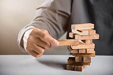 Business Hand Playing Tower Wooden Blocks Game Stock Photography