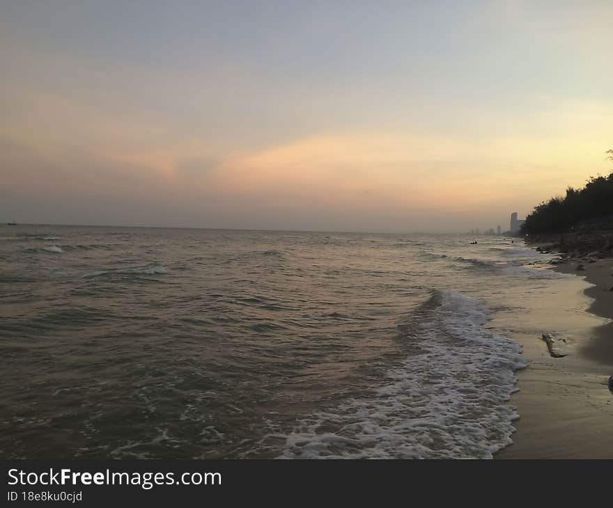 Sunset on the seashore of the Gulf of Thailand. Peaceful atmosphere. looking down from the top of the mountain