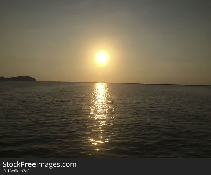 Sunset on the seashore of the Gulf of Thailand. Peaceful atmosphere. looking down from the top of the mountain