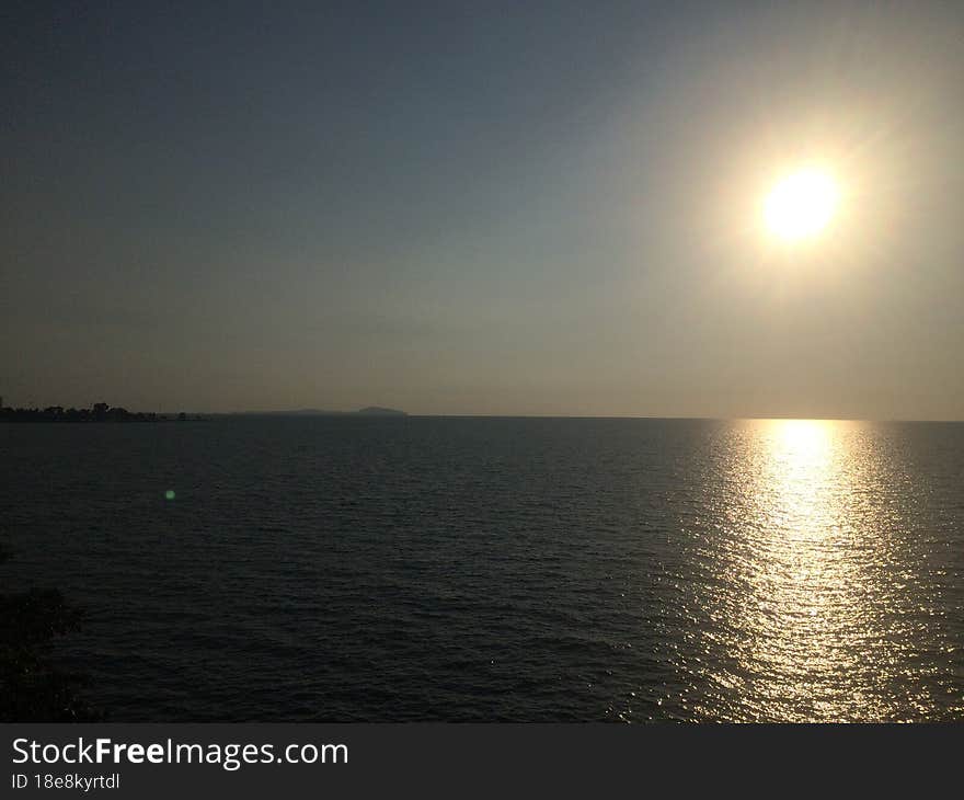 Sunset on the seashore of the Gulf of Thailand. Peaceful atmosphere.