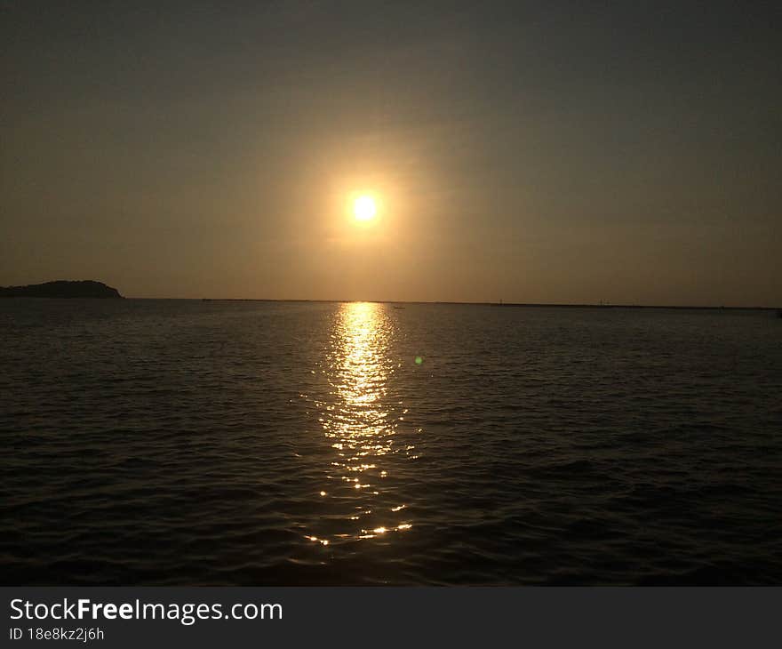 Sunset on the seashore of the Gulf of Thailand. Peaceful atmosphere.