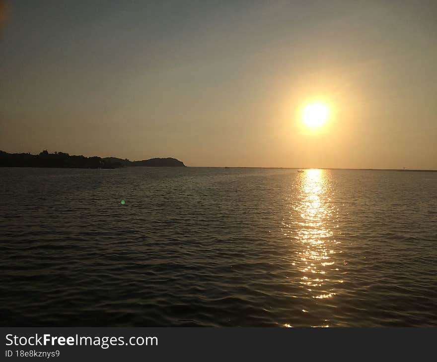 Sunset on the seashore of the Gulf of Thailand. Peaceful atmosphere.