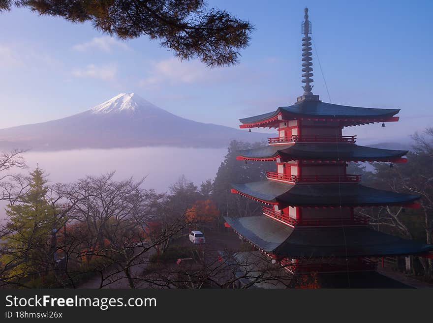 Rare scene of Chureito pagoda and Mount Fuji with morning fog, Japan in autumn.