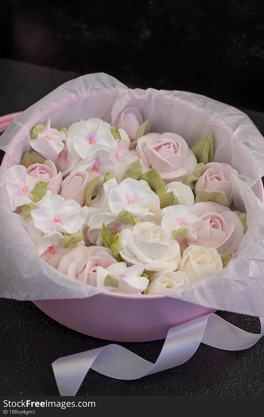 homemade marshmallows in a gift box on a dark background, a beautiful delicate bouquet of marshmallow flowers, holiday concept, gifts