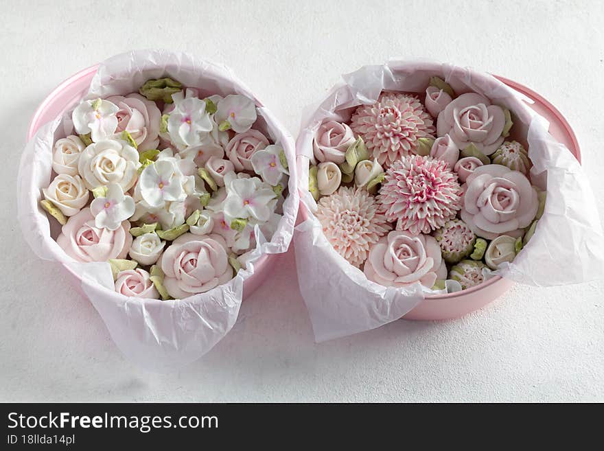 homemade marshmallows in a gift box on a light background, a beautiful delicate bouquet of marshmallow flowers, holiday concept, gifts