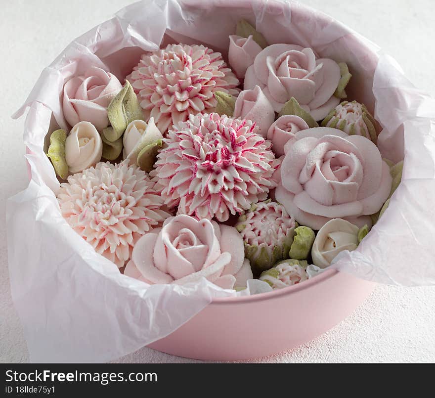 homemade marshmallows in a gift box on a light background, a beautiful delicate bouquet of marshmallow flowers, holiday concept, g