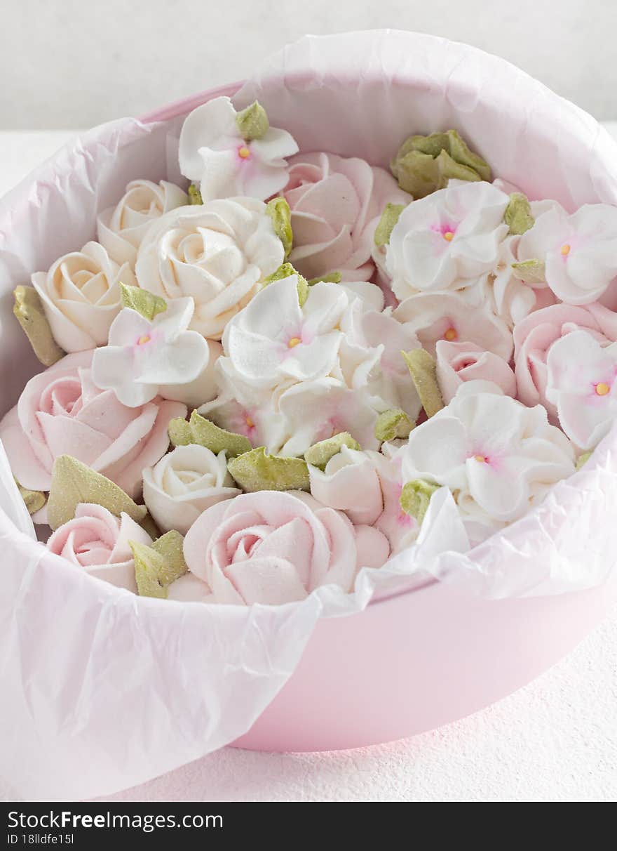 homemade marshmallows in a gift box on a light background, a beautiful delicate bouquet of marshmallow flowers, holiday concept, g