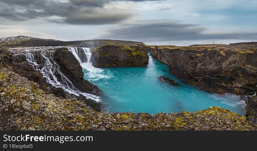 Picturesque waterfall Sigoldufoss autumn view. Season changing in southern Highlands of Iceland.