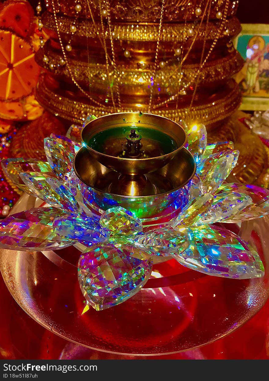 An oil lamp on a decorative stand colorful