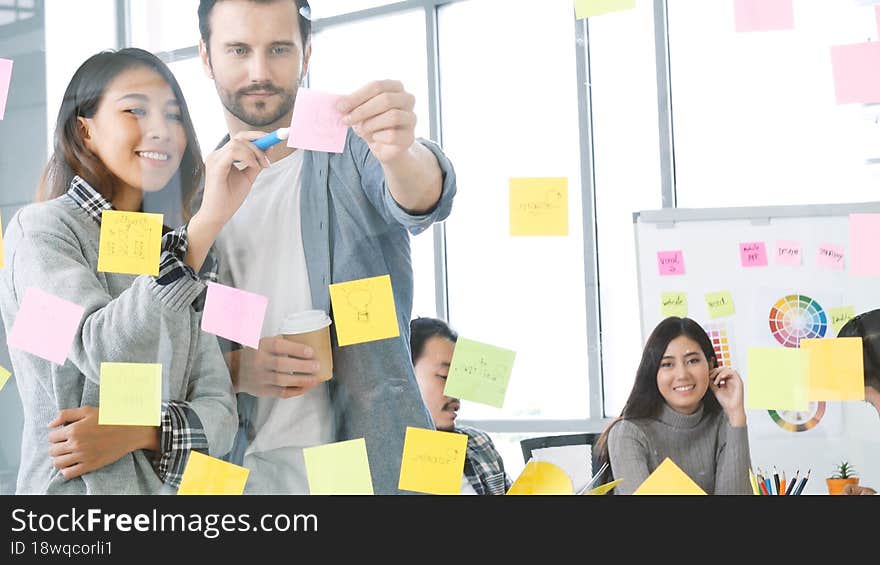 Creative design women present talking use sticky notes post, present ideas. Diversity multi ethnic group brainstorming teams with business partner meeting and share ideas in conference room. Creative design women present talking use sticky notes post, present ideas. Diversity multi ethnic group brainstorming teams with business partner meeting and share ideas in conference room