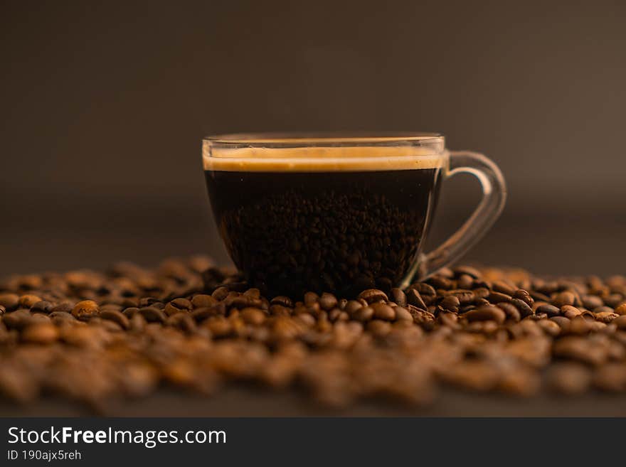 Cup with coffee and beans Macro view