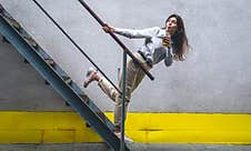 Business Young Woman Near The Stairs With A Cup Of Coffee. Stock Photos