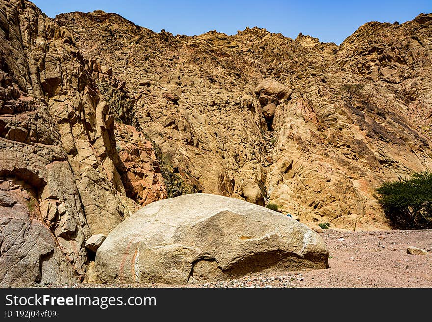 Canyon Of The Yellow Sandy Mountains In The Desert Of Jordan Near The City Of Aqaba, On The Shores Of The Red Sea