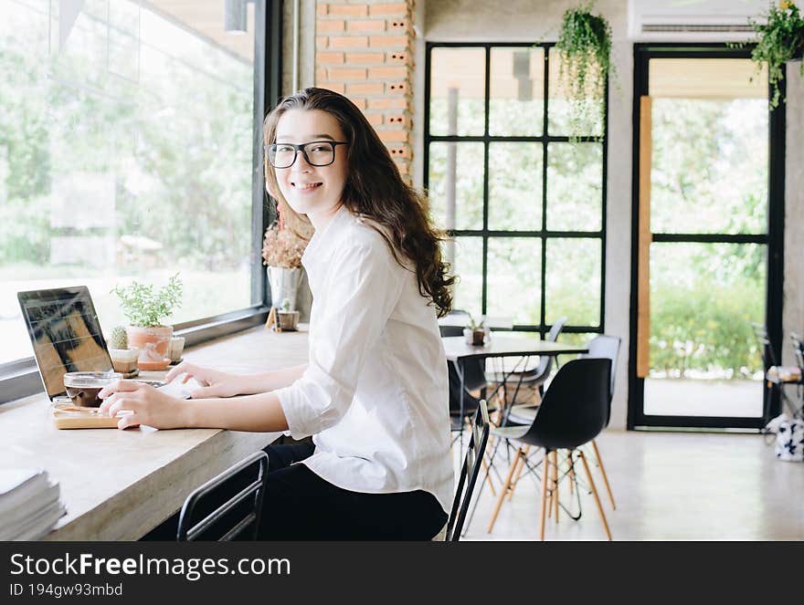 Conceptual shot of woman while working in cafe. Conceptual shot of woman while working in cafe.
