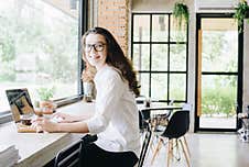 Portrait Of Young Mixed Race Businesswoman Her Dad Is British, Her Mom Is Thailand Working In Her Office. Royalty Free Stock Photo