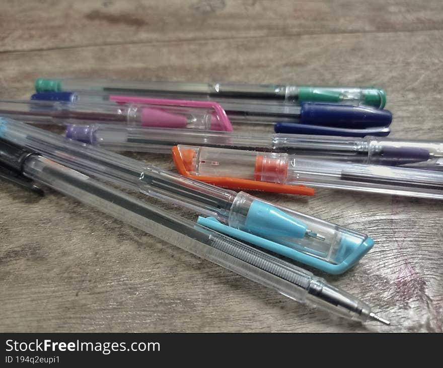 colorful pencils on a desk with cap removed