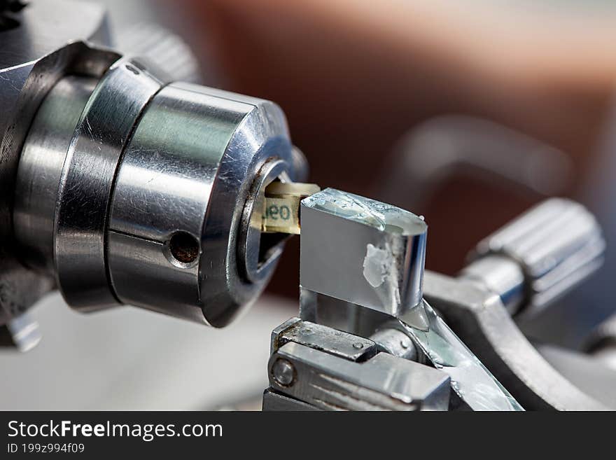 Closeup of cut sections and the glass knife with waterboat mounted on an ultramicrotome.