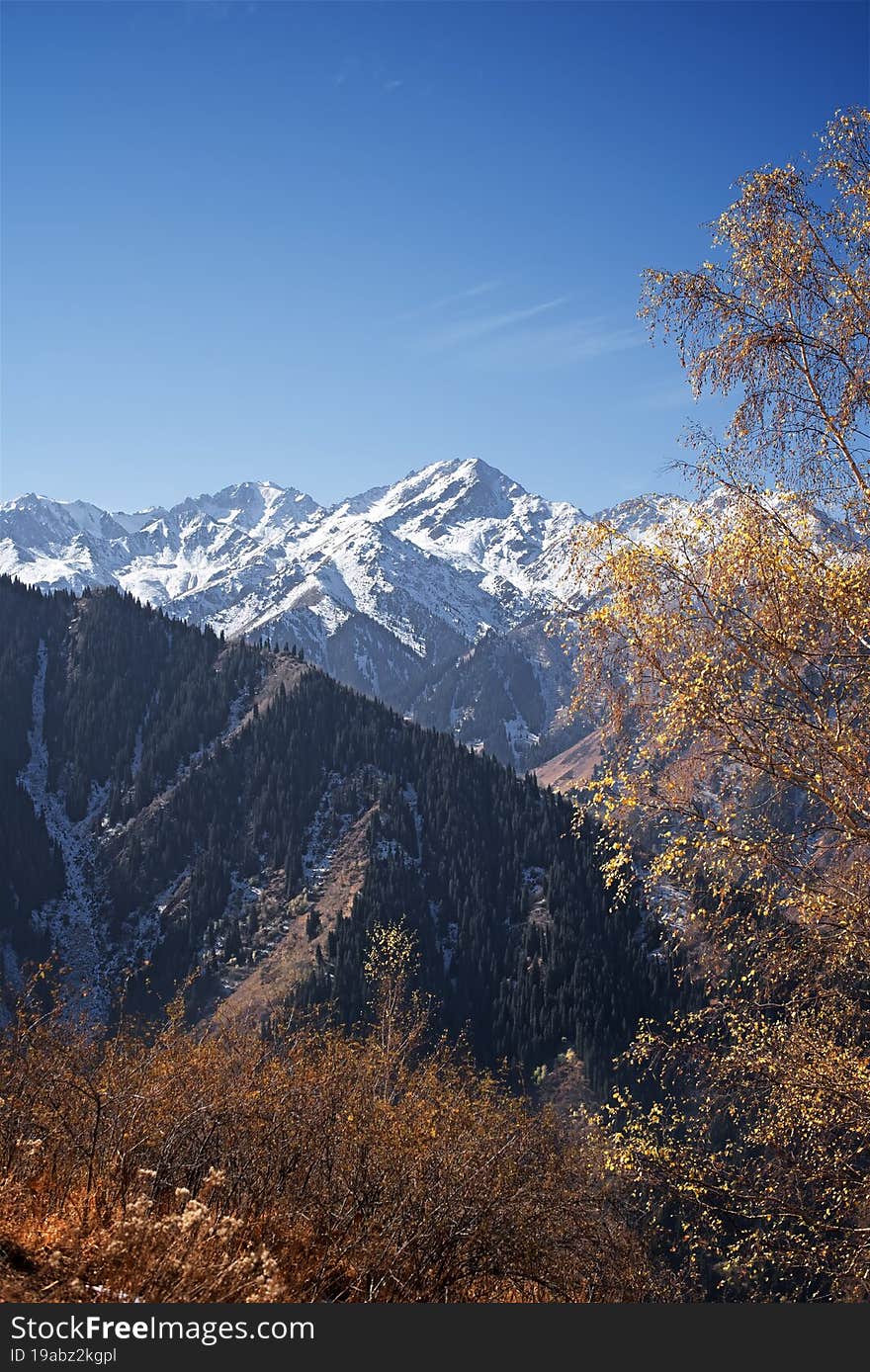 Beautiful autumn mountains covered by snow