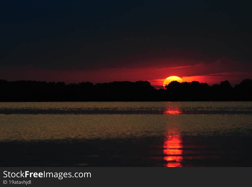 A dramatic sunset at Lake Tisza, Hungary, in the summer