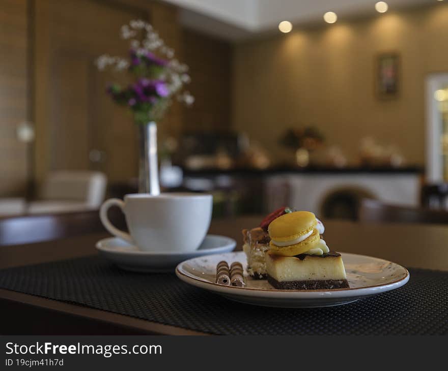 Breakfast with delicious cake and coffee in a cafe. Breakfast with delicious cake and coffee in a cafe