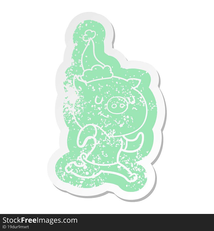 happy cartoon distressed sticker of a pig running wearing santa hat