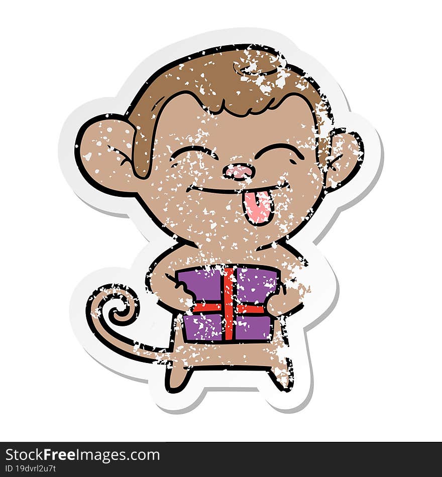 distressed sticker of a funny cartoon monkey with christmas present