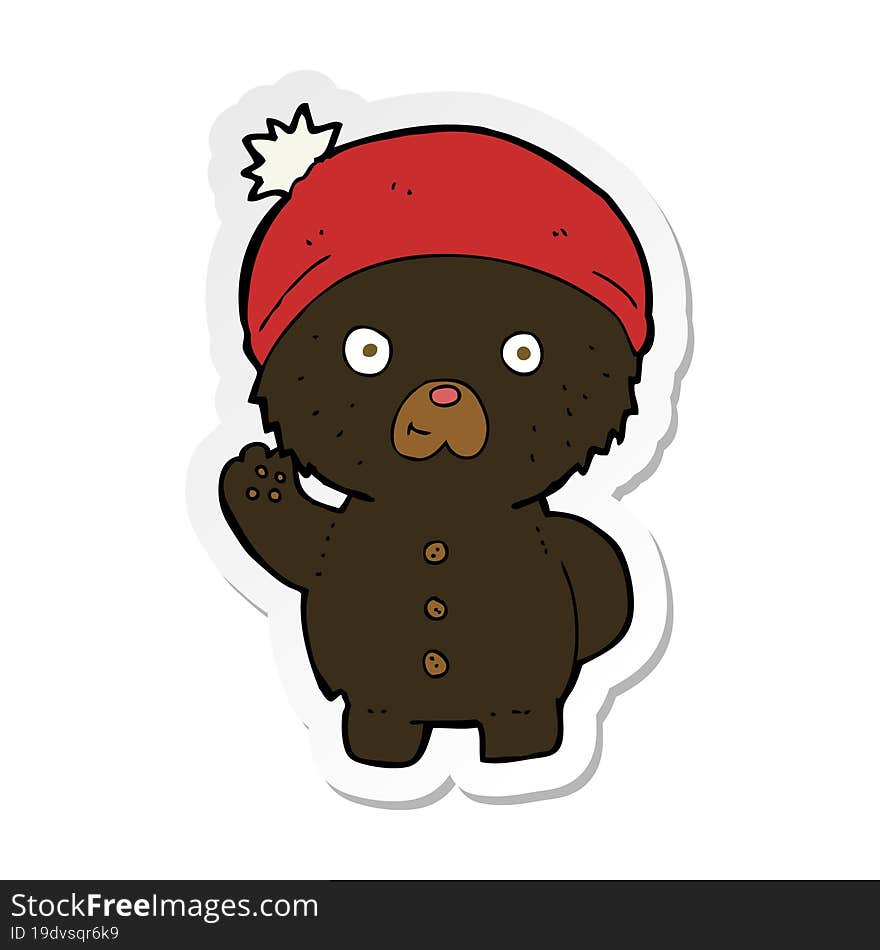 Sticker Of A Cartoon Waving Black Teddy Bear In Winter Hat