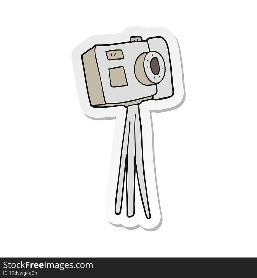 sticker of a cartoon camera on tripod