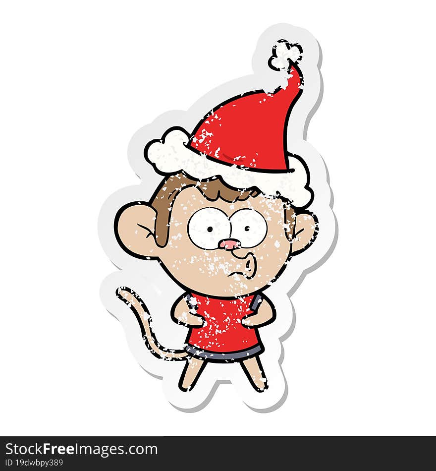 Distressed Sticker Cartoon Of A Surprised Monkey Wearing Santa Hat