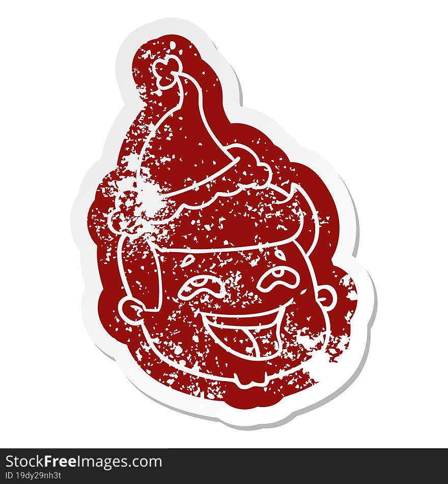 happy cartoon distressed sticker of a male face wearing santa hat