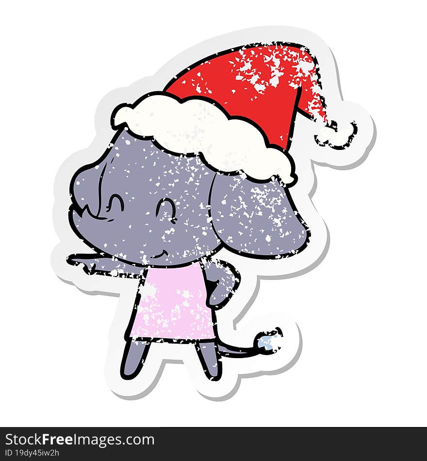 cute distressed sticker cartoon of a elephant wearing santa hat