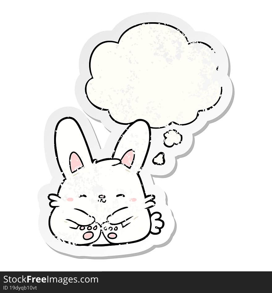 cartoon rabbit with thought bubble as a distressed worn sticker