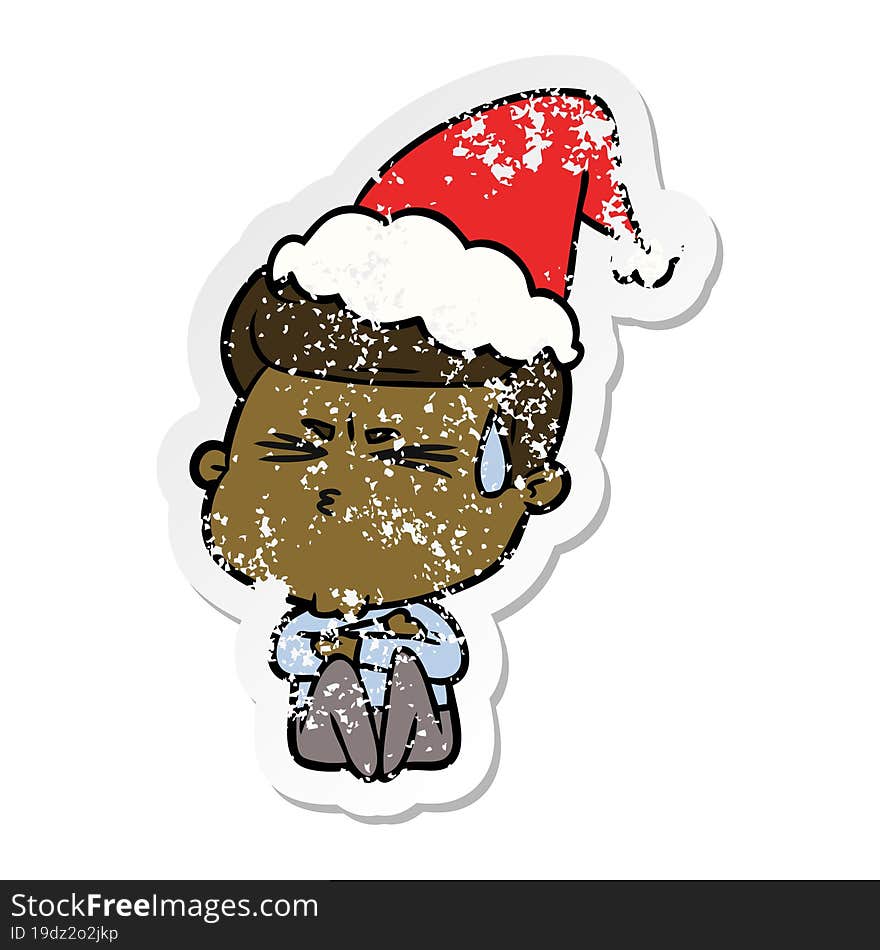 hand drawn distressed sticker cartoon of a man sweating wearing santa hat