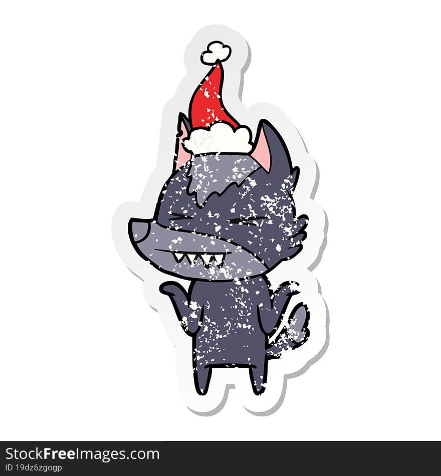 angry wolf distressed sticker cartoon of a wearing santa hat