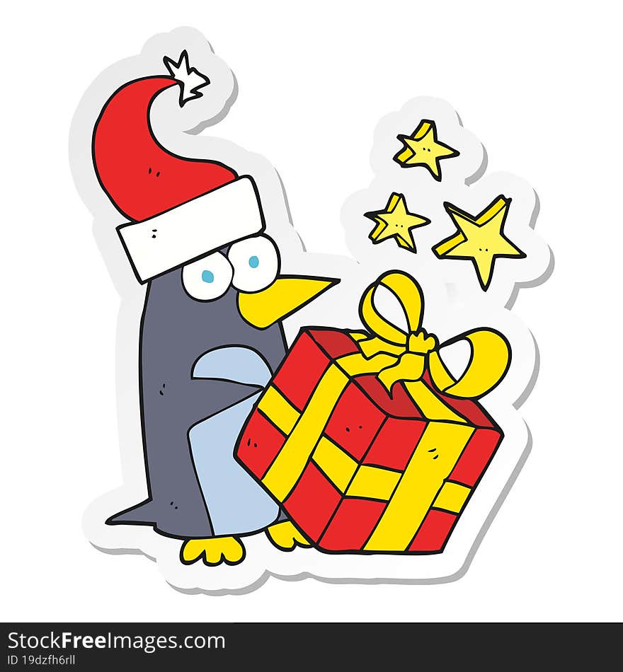 Sticker Of A Cartoon Christmas Penguin With Present