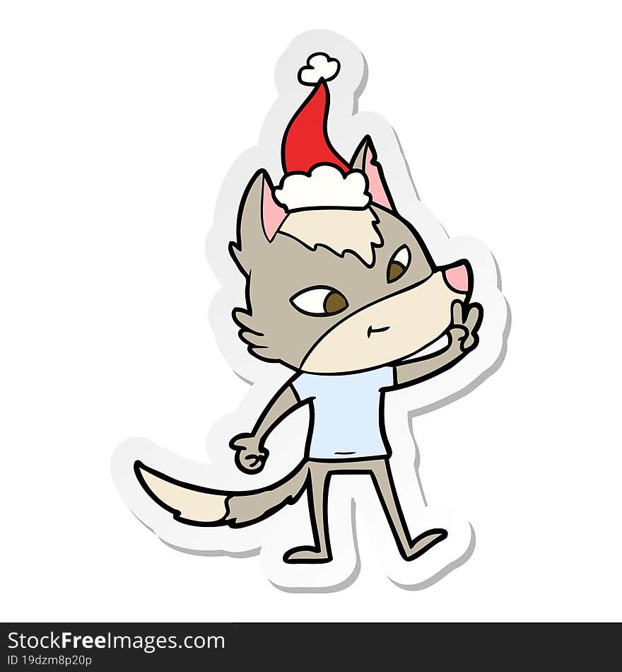 friendly hand drawn sticker cartoon of a wolf giving peace sign wearing santa hat