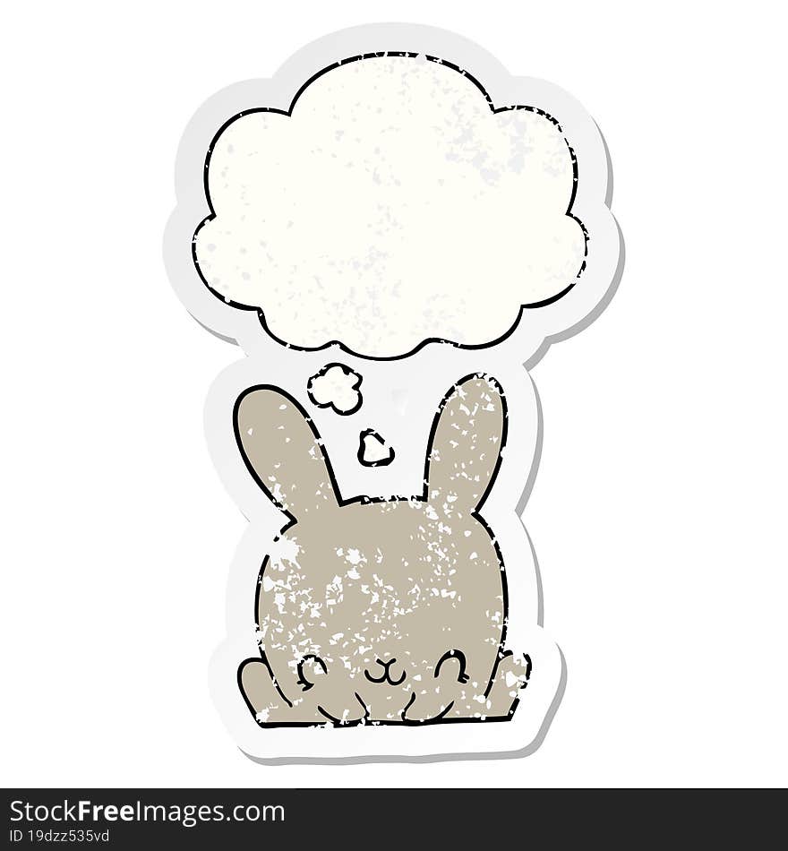 cartoon rabbit and thought bubble as a distressed worn sticker