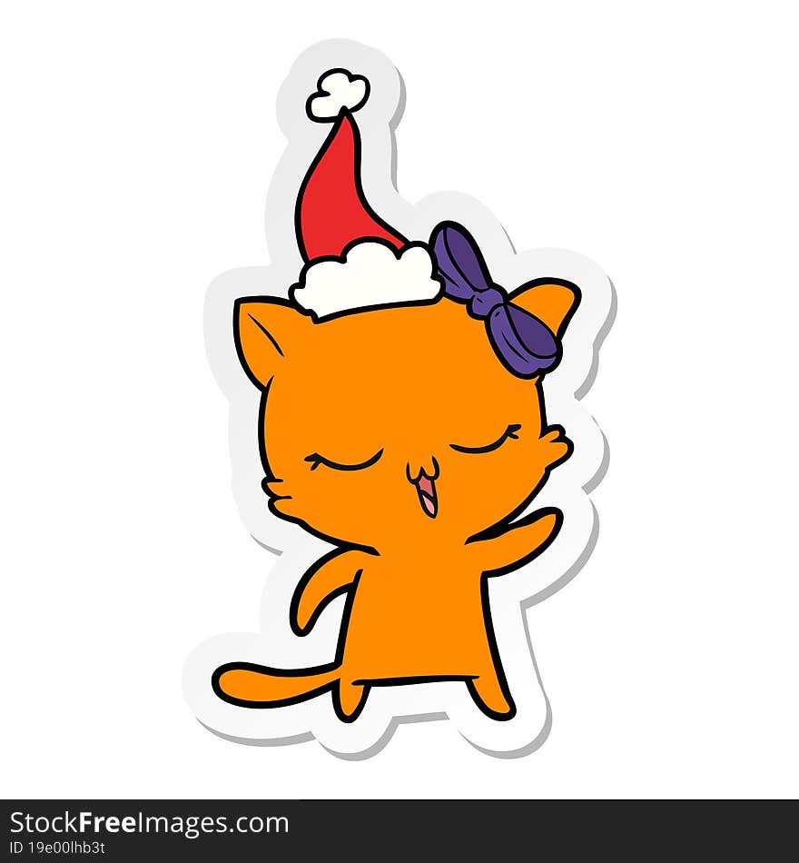 Sticker Cartoon Of A Cat With Bow On Head Wearing Santa Hat