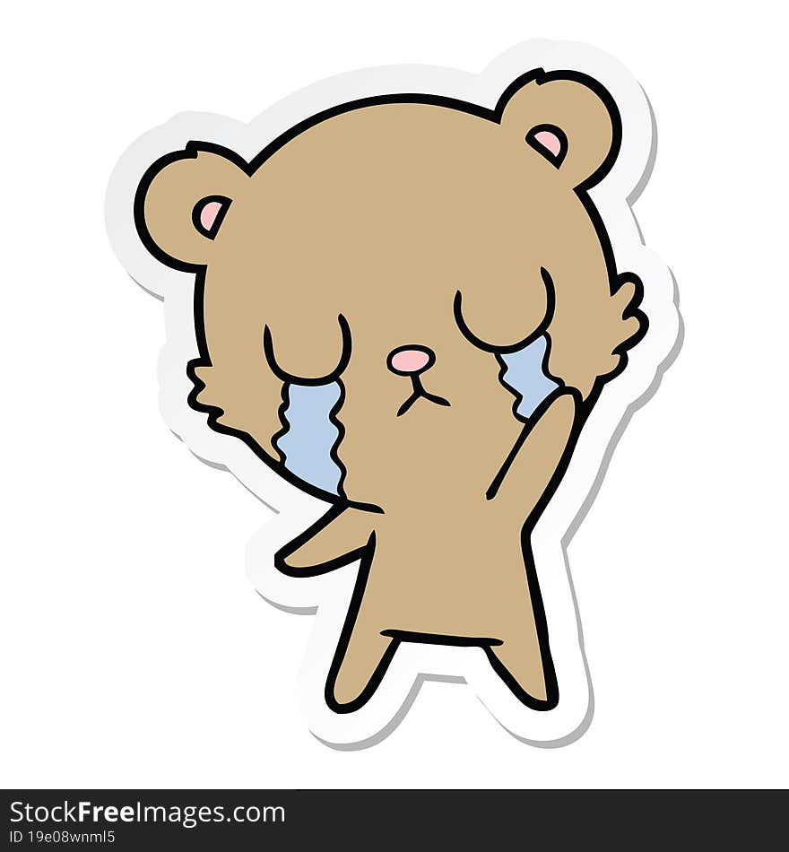 sticker of a crying cartoon bear waving