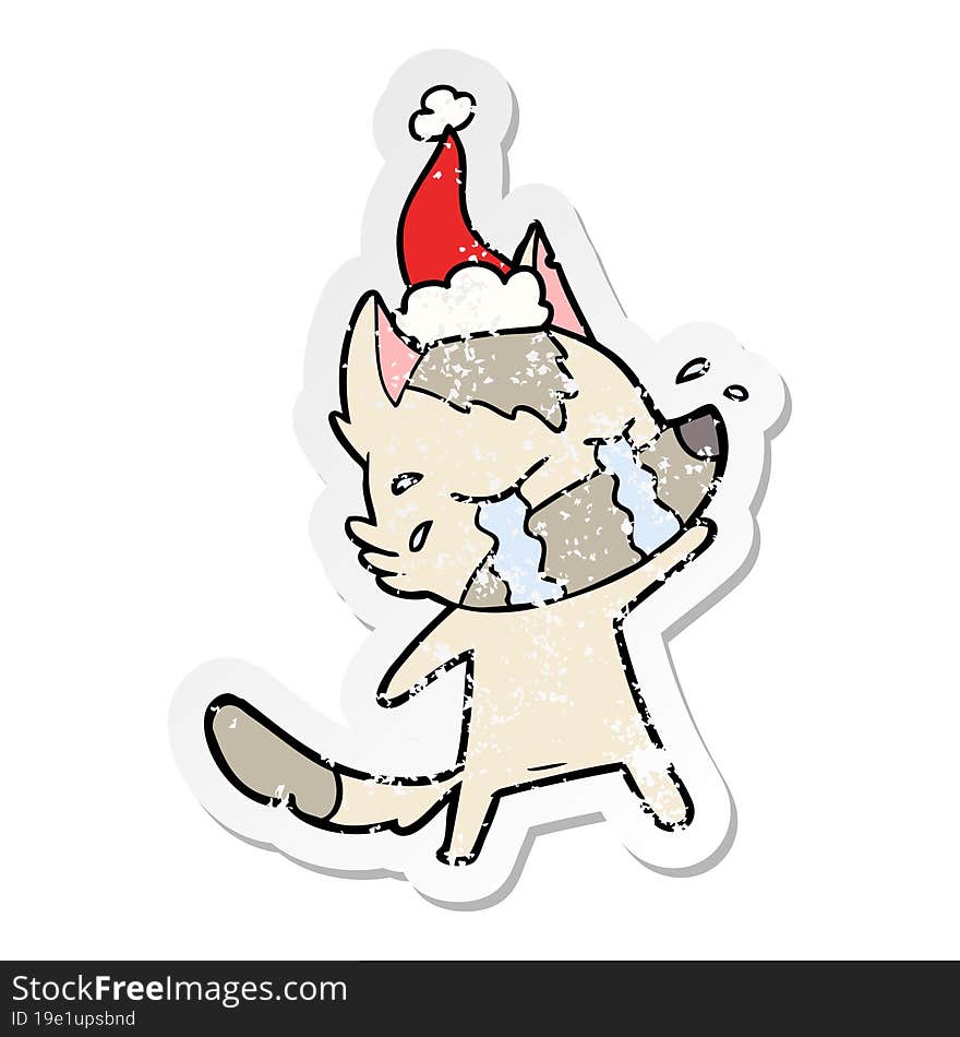 distressed sticker cartoon of a crying wolf wearing santa hat