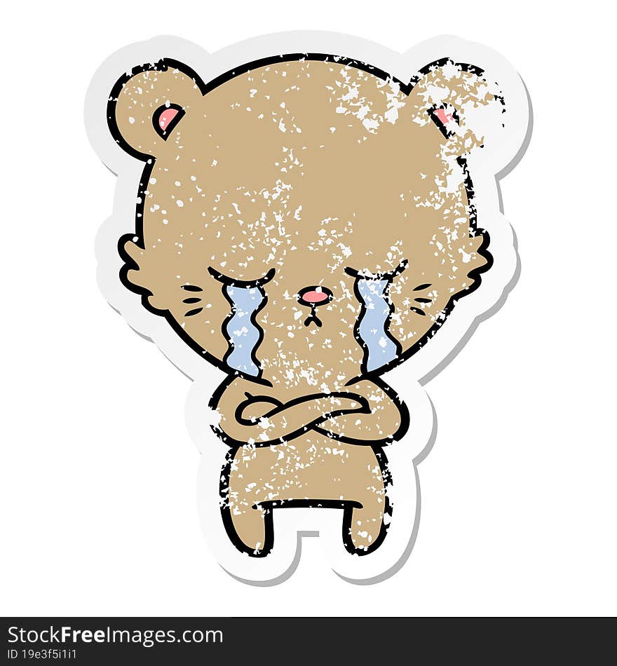 Distressed Sticker Of A Crying Cartoon Bear With Folded Arms