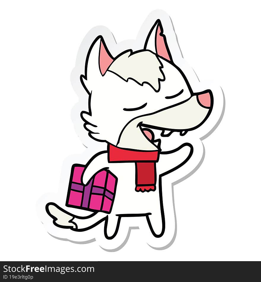 sticker of a cartoon wolf with christmas present laughing