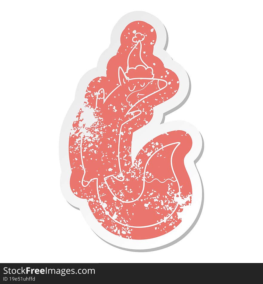 cartoon distressed sticker of a jumping fox wearing santa hat