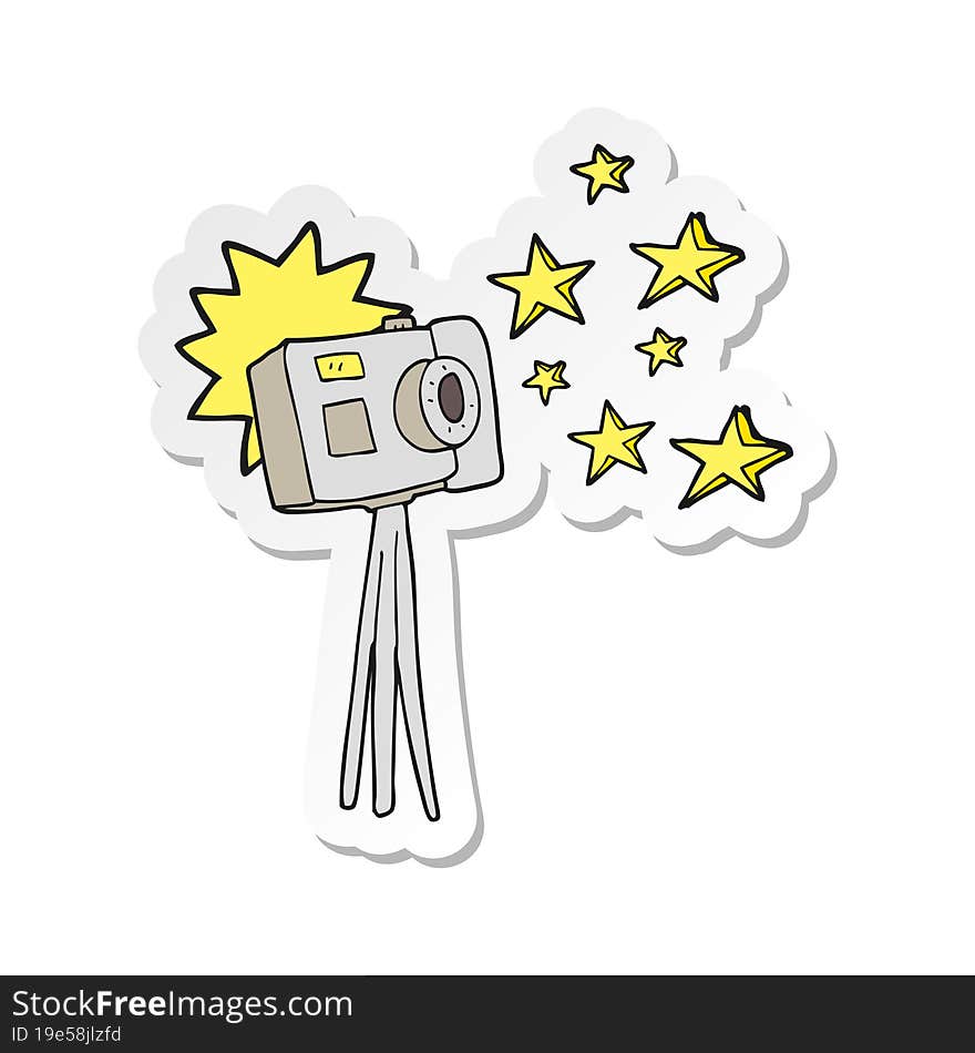 sticker of a cartoon camera on tripod with flash